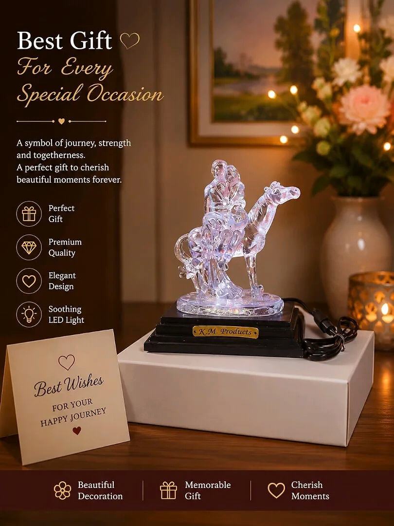 decorative crystal showpiece ko dikhati hai, jismein ek camel aur uspar baithe hue logon ki figure bani hui hai